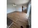 This living room features new wood flooring, a fireplace, and neutral paint at 1925 W State Road 32, Lebanon, IN 46052