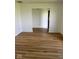 Open concept living room with beautiful wood-look floors at 1925 W State Road 32, Lebanon, IN 46052
