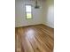 Bright living room with beautiful wood-look floors and a classic chandelier at 1925 W State Road 32, Lebanon, IN 46052
