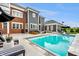 Beautiful backyard with a refreshing pool, lounge chairs, and an umbrella at 2037 Stanhope St, Carmel, IN 46032