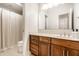 Well-lit bathroom featuring a vanity with drawers and a shower with curtain at 2037 Stanhope St, Carmel, IN 46032