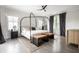 Serene bedroom with canopy bed, natural light, and hardwood floors at 2037 Stanhope St, Carmel, IN 46032