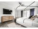 Comfortable bedroom features hardwood floors, neutral paint, and natural light at 2037 Stanhope St, Carmel, IN 46032