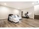 Inviting living room with a comfortable couch, wood floors, and exercise equipment at 2037 Stanhope St, Carmel, IN 46032