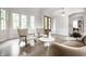Stylish living room showcasing modern furniture, large windows, and a comfortable seating arrangement at 2037 Stanhope St, Carmel, IN 46032