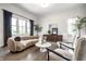 Bright and airy living room featuring stylish furniture, large windows, and elegant decor at 2037 Stanhope St, Carmel, IN 46032
