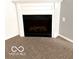 Close up of the decorative fireplace with a white mantel and black firebox at 3016 Wildcat Ln, Indianapolis, IN 46203