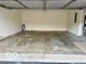 Spacious two car garage with painted walls and concrete floor at 3016 Wildcat Ln, Indianapolis, IN 46203