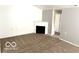 Living area featuring a fireplace, neutral color scheme, and a carpeted floor at 3016 Wildcat Ln, Indianapolis, IN 46203