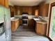Modern kitchen with stainless steel appliances, light countertops, and plenty of cabinet space at 310 S Shady Ln, Muncie, IN 47304