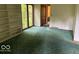 Living room displaying built-in shelves and a window overlooking the outdoors at 310 S Shady Ln, Muncie, IN 47304