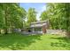Beautiful backyard featuring a raised patio and a fenced in yard with a detached garage at 3333 Melbourne S Rd, Indianapolis, IN 46228