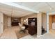 Finished basement area featuring a desk, TV and tile flooring at 3333 Melbourne S Rd, Indianapolis, IN 46228
