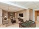 Finished basement area featuring a TV, sofa, foosball table and tile flooring at 3333 Melbourne S Rd, Indianapolis, IN 46228
