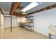 Unfinished basement with white walls and concrete floor offering great potential for storage or customization at 3333 Melbourne S Rd, Indianapolis, IN 46228