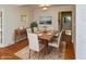 Formal dining room features hardwood floors, modern lighting, and is adjacent to the kitchen at 3333 Melbourne S Rd, Indianapolis, IN 46228