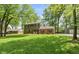 Traditional two-story home with a brick facade, well-manicured lawn, and lovely curb appeal at 3333 Melbourne S Rd, Indianapolis, IN 46228