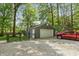 Detached garage with ample parking space and a red pickup truck nearby at 3333 Melbourne S Rd, Indianapolis, IN 46228