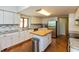 Updated kitchen featuring granite countertops, stainless steel appliances, and a center island at 3333 Melbourne S Rd, Indianapolis, IN 46228