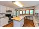 Well-appointed kitchen with stainless steel appliances, island with butcher block, and ample counter space at 3333 Melbourne S Rd, Indianapolis, IN 46228