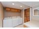 Functional laundry room with washer, dryer, and ample storage cabinets at 3333 Melbourne S Rd, Indianapolis, IN 46228
