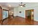 Open-concept living room features hardwood floors, sliding glass doors to an outdoor patio and seamless flow at 3333 Melbourne S Rd, Indianapolis, IN 46228