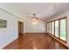 Bright living room with hardwood floors, natural light, and wood-trimmed windows at 3333 Melbourne S Rd, Indianapolis, IN 46228