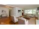 Bright living room with hardwood floors, wood accent wall, and large windows offering abundant natural light at 3333 Melbourne S Rd, Indianapolis, IN 46228