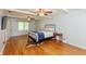 Spacious main bedroom with hardwood floors, lots of natural light, and a ceiling fan at 3333 Melbourne S Rd, Indianapolis, IN 46228