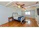 Large main bedroom features hardwood floors, white trim, and a ceiling fan at 3333 Melbourne S Rd, Indianapolis, IN 46228