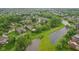 Beautiful aerial view of a lush, green residential community with ponds and well-maintained homes at 3744 Abney Point Dr, Carmel, IN 46077