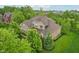 Aerial shot of a beautiful home with mature trees and a well-maintained yard at 3744 Abney Point Dr, Carmel, IN 46077