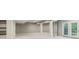 Spacious finished basement featuring built-in shelving and double door access to the backyard at 3744 Abney Point Dr, Carmel, IN 46077
