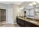 Bathroom featuring double sinks, granite countertops, and a large mirror at 3744 Abney Point Dr, Carmel, IN 46077