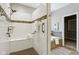 Bathroom features a shower, bathtub, and mosaic tile accents at 3744 Abney Point Dr, Carmel, IN 46077