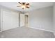 Spacious bedroom with a ceiling fan and double closets, offering lots of storage space at 3744 Abney Point Dr, Carmel, IN 46077