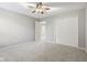 Well-lit bedroom with carpet, neutral walls, and double-door closet space at 3744 Abney Point Dr, Carmel, IN 46077