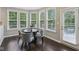 Bright dining area featuring large windows offering plenty of natural light and backyard views at 3744 Abney Point Dr, Carmel, IN 46077