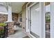 Inviting front porch with stone accents, a cozy seating area, and a beautifully crafted front door at 3744 Abney Point Dr, Carmel, IN 46077