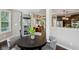 Open-concept living space showcases elegant living and dining areas, residential elevator, and abundant natural light at 3744 Abney Point Dr, Carmel, IN 46077