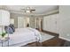 Bedroom featuring hardwood floors, a ceiling fan, and ample closet space at 3744 Abney Point Dr, Carmel, IN 46077