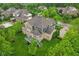 Aerial view of a beautiful home with a private deck and well-manicured lawn, offering a serene outdoor living space at 3744 Abney Point Dr, Carmel, IN 46077