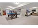 Spacious finished basement with a pool table, treadmill, and entertainment area at 3823 Brigade Cir, Carmel, IN 46032