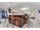 Basement bar with wood counter and seating, perfect for entertaining guests at 3823 Brigade Cir, Carmel, IN 46032