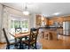 Dining area with wood table, cabinets, and sliding doors to screened in porch at 3823 Brigade Cir, Carmel, IN 46032