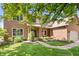 Charming brick home featuring a well-kept lawn and lush greenery in a suburban setting at 3823 Brigade Cir, Carmel, IN 46032