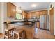 Traditional kitchen with granite countertops, stainless steel appliances, and island with seating at 3823 Brigade Cir, Carmel, IN 46032