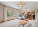 Spacious living room open to dining area with a large window and neutral décor at 3823 Brigade Cir, Carmel, IN 46032
