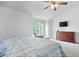 Sunlit main bedroom featuring a vaulted ceiling, large window and dresser with TV at 3823 Brigade Cir, Carmel, IN 46032