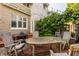 Spacious backyard with brick patio and a classic outdoor dining set, ideal for entertaining and barbecues at 3840 N Washington Blvd, Indianapolis, IN 46205